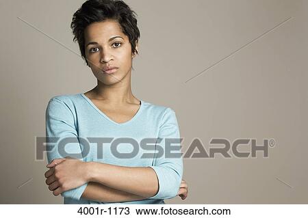 Portrait of a mid adult woman looking serious View Large Photo Image Stock Image - Portrait of a mid adult woman looking serious. Fotosearch