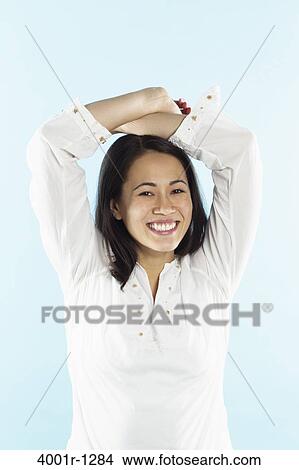 Picture - Portrait of a young woman smiling. Fotosearch