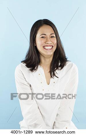 Stock Photo - Portrait of a young woman smiling. Fotosearch