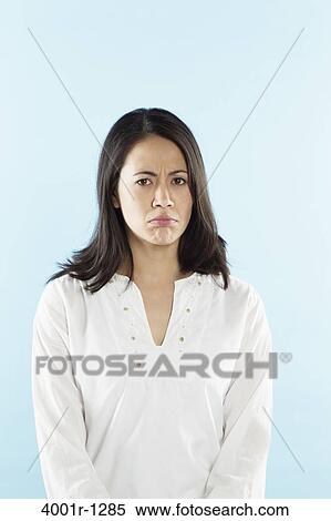 Portrait of a young woman sulking View Large Photo Image Stock Photography - Portrait of a young woman sulking. Fotosearch