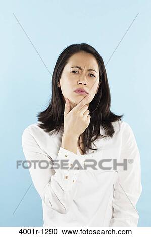Portrait of a young woman thinking View Large Photo Image Stock Image - Portrait of a young woman thinking. Fotosearch