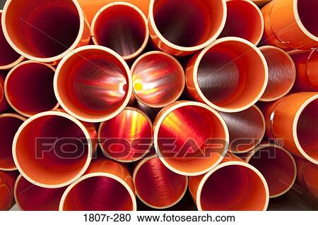 PVC pipes stacked in a construction site View Large Photo Image Stock Image - PVC pipes stacked in a construction site. Fotosearch