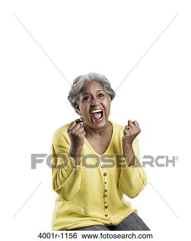 Stock Photograph - Senior woman looking excited. Fotosearch