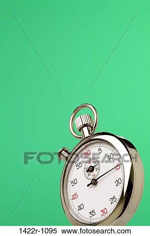 Stopwatch against green background View Large Photo Image Stock Photography - Stopwatch against green background. Fotosearch