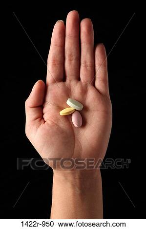 Three colorful pills in the palm of a person View Large Photo Image Stock Image - Three colorful pills in the palm of a person. Fotosearch