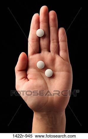 Three white pills in the palm of a person View Large Photo Image Stock Photography - Three white pills in the palm of a person. Fotosearch