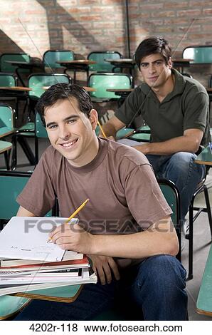 Two University students in a classroom View Large Photo Image Stock Photo - Two University students in a classroom. Fotosearch