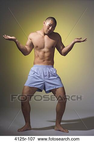 Young man shrugging View Large Photo Image Stock Photo - Young man shrugging. Fotosearch