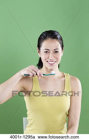 Young woman brushing teeth View Large Photo Image Stock Image - Young woman brushing teeth. Fotosearch