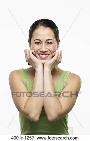 Young woman posing and smiling View Large Photo Image Stock Photo - Young woman posing and smiling. Fotosearch