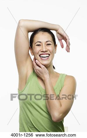 Young woman posing and smiling View Large Photo Image Stock Photograph - Young woman posing and smiling. Fotosearch