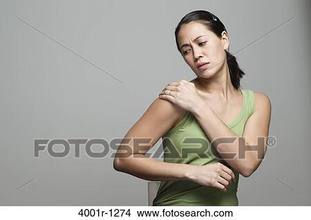 Picture - Young woman suffering from backache. Fotosearch
