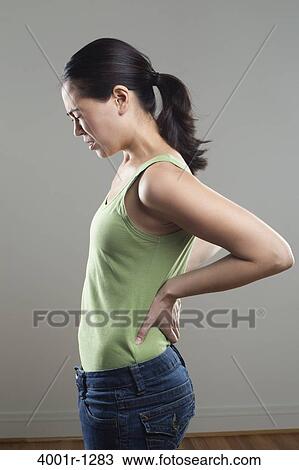Young woman suffering from backache View Large Photo Image Stock Image - Young woman suffering from backache. Fotosearch