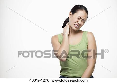 Young woman suffering with neck pain View Large Photo Image Stock Image - Young woman suffering with neck pain. Fotosearch