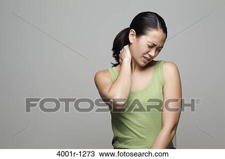 Young woman suffering with neck pain View Large Photo Image Stock Image - Young woman suffering with neck pain. Fotosearch