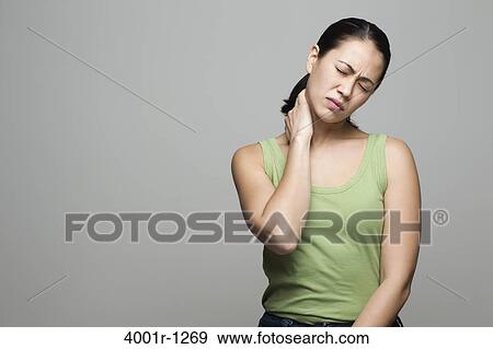 Young woman suffering with neck pain View Large Photo Image Stock Photo - Young woman suffering with neck pain. Fotosearch