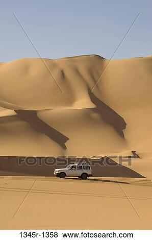 4x4 vehicle in a desert, Erg Awbari, Fezzan, Libya View Large Photo Image Stock Photo - 4x4 vehicle in a desert, Erg Awbari, Fezzan, Libya. Fotosearch