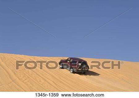 4x4 vehicle in a desert, Erg Awbari, Fezzan, Libya View Large Photo Image Stock Photo - 4x4 vehicle in a desert, Erg Awbari, Fezzan, Libya. Fotosearch