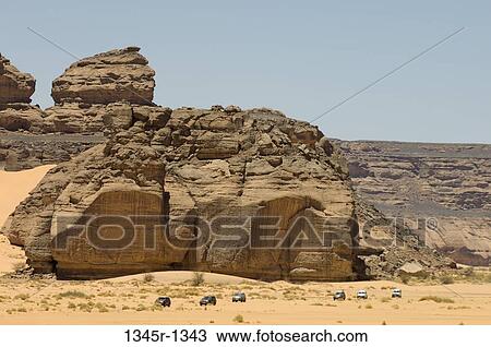 4x4 vehicles near rock formations, Wadi Teshuinat, Tadrart Acacus, Fezzan, Libya View Large Photo Image Stock Image - 4x4 vehicles near rock formations, Wadi Teshuinat, Tadrart Acacus, Fezzan, Libya. Fotosearch