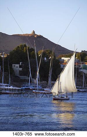 A sailboat on the Nile River at Aswan, Egypt View Large Photo Image Stock Photography - A sailboat on the Nile River at Aswan, Egypt. Fotosearch