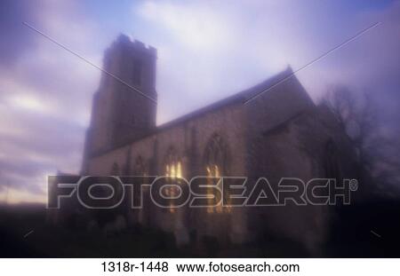 Atmospheric English Decorated Gothic flint church with bell tower catching last rays of light under evening sky Honing Norfolk UK View Large Photo Image Stock Photo - Atmospheric English Decorated Gothic flint church with bell tower catching last rays of light under evening sky Honing Norfolk UK. Fotosearch