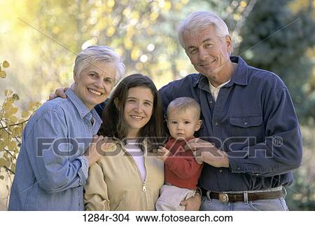 Picture - Baby boy with his mother and grandparents. Fotosearch