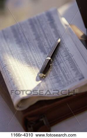 Ballpoint pen on a newspaper View Large Photo Image Stock Image - Ballpoint pen on a newspaper. Fotosearch