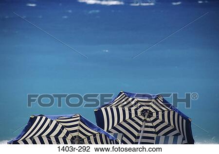 Beach umbrellas on the beach, Greece View Large Photo Image Stock Image - Beach umbrellas on the beach, Greece. Fotosearch
