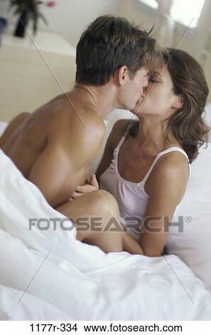 bed, brunette, Caucasian, couple, indoors, kiss View Large Photo Image Picture - bed, brunette, Caucasian, couple, indoors, kiss. Fotosearch