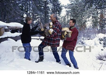 Boy collecting firewood with his father and grandfather View Large Photo Image Stock Image - Boy collecting firewood with his father and grandfather. Fotosearch