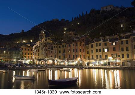 Stock Image - Buildings at the waterfront, Church of San Giorgio Maggiore, Portofino, Liguria, Italy. Fotosearch
