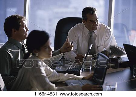 Business executives in a meeting View Large Photo Image Stock Image - Business executives in a meeting. Fotosearch
