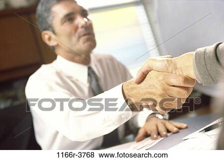 Business executives shaking hands View Large Photo Image Stock Photo - Business executives shaking hands. Fotosearch