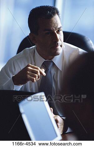 Businessman talking View Large Photo Image Picture - Businessman talking. Fotosearch