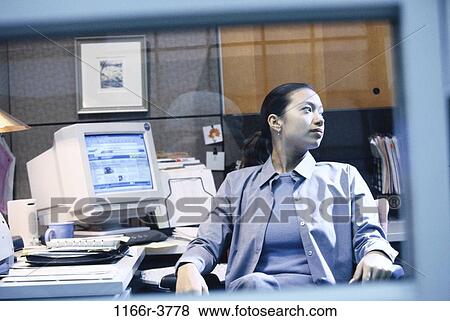 Businesswoman in an office View Large Photo Image Stock Photo - Businesswoman in an office. Fotosearch