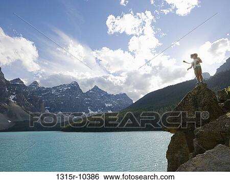 Canada, Alberta, Banff National Park, father and daughter standing on rock overlooking Moraine Lake View Large Photo Image Stock Photograph - Canada, Alberta, Banff National Park, father and daughter standing on rock overlooking Moraine Lake. Fotosearch