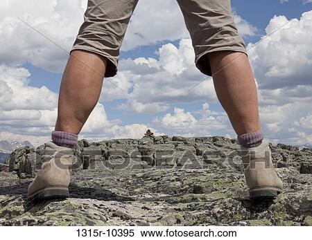 Canada, Alberta, Banff National Park, low section of hiker standing on rock View Large Photo Image Stock Photography - Canada, Alberta, Banff National Park, low section of hiker standing on rock. Fotosearch
