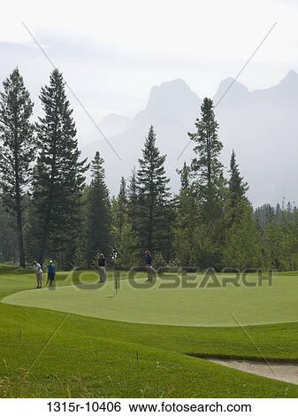 Canada, Alberta, Canmore, Distant golfers on Silvertip Golf Coiurse View Large Photo Image Stock Photograph - Canada, Alberta, Canmore, Distant golfers on Silvertip Golf Coiurse. Fotosearch