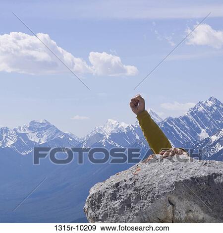Canada, Alberta, Climber reaching summit of mountain View Large Photo Image Stock Photo - Canada, Alberta, Climber reaching summit of mountain. Fotosearch