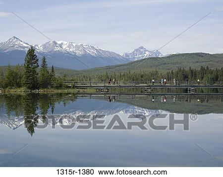 Canada, Alberta, Jasper National Park, Pyramid Lake, people crossing bridge View Large Photo Image Stock Image - Canada, Alberta, Jasper National Park, Pyramid Lake, people crossing bridge. Fotosearch