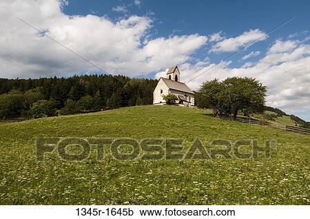 Stock Image - Church on a landscape, St. Jacob Church, Funes Valley, Dolomites, Trentino-Alto-Adige, Italy. Fotosearch