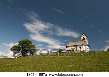 Stock Image - Church on a landscape, St. Jacob Church, Funes Valley, Dolomites, Trentino-Alto-Adige, Italy. Fotosearch
