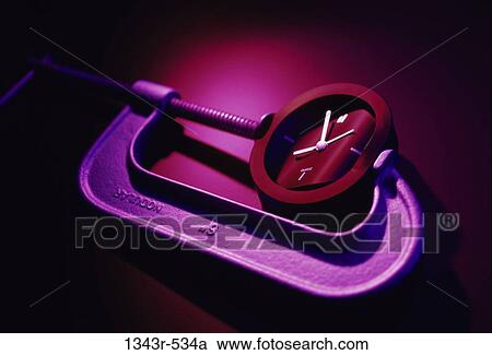 Clock being squeezed in a clamp View Large Photo Image Stock Image - Clock being squeezed in a clamp. Fotosearch