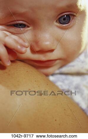 Close-up of a baby boy crying View Large Photo Image Stock Photo - Close-up of a baby boy crying. Fotosearch