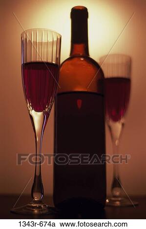 Stock Image - Close-up of a bottle and two glasses of wine. Fotosearch