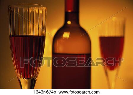 Close-up of a bottle and two glasses of wine View Large Photo Image Stock Image - Close-up of a bottle and two glasses of wine. Fotosearch