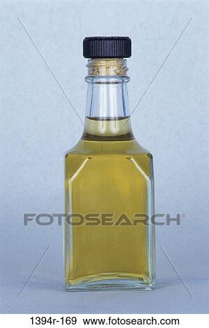 Close-up of a bottle of oil View Large Photo Image Stock Photo - Close-up of a bottle of oil. Fotosearch