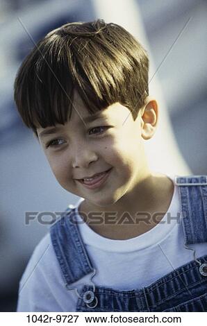 Close-up of a boy looking sideways View Large Photo Image Stock Photo - Close-up of a boy looking sideways. Fotosearch