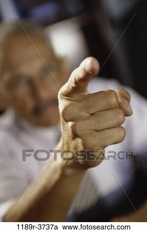 Close-up of a businessman pointing forward View Large Photo Image Stock Image - Close-up of a businessman pointing forward. Fotosearch