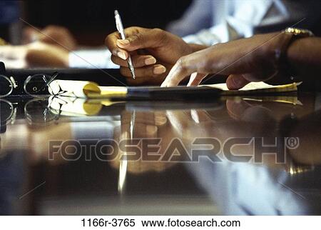Stock Photography - Close-up of a businessman's hand holding a pen. Fotosearch